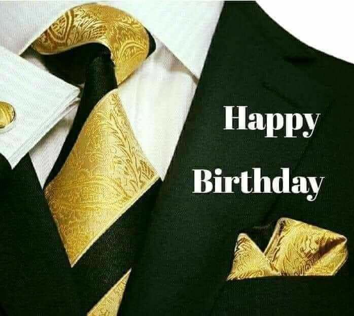 a man wearing a suit and tie with the words happy birthday written on it