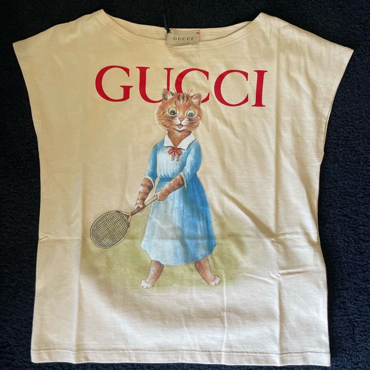 Gucci Kitty Tennis Tee Gucci Cotton Tops For Spring, Gucci Crew Neck Spring Tops, Gucci Short Sleeve Tops For Spring, Gucci Graphic Print Top For Spring, Gucci Shirts, Gucci Kids, Kid Tees, Kids Shirts, Shirts Tops