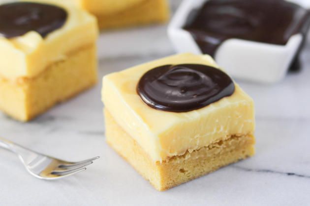 two pieces of cake sitting on top of a table