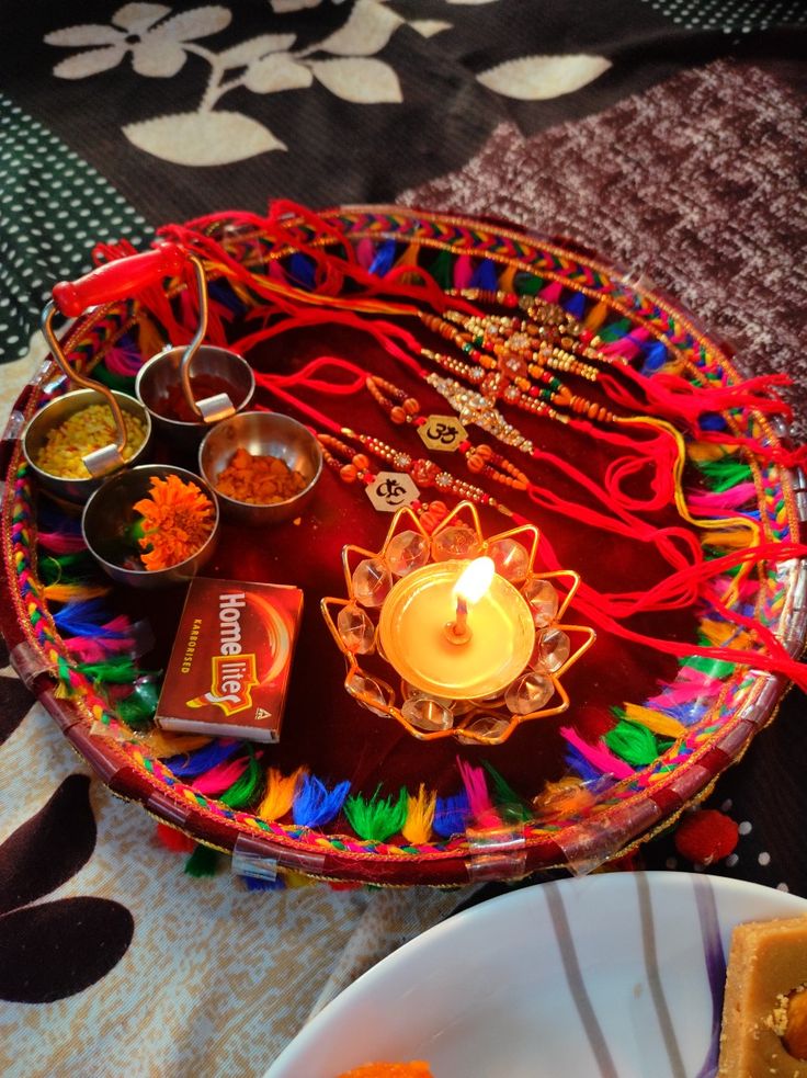 a plate with some food on it and a candle in the middle next to it