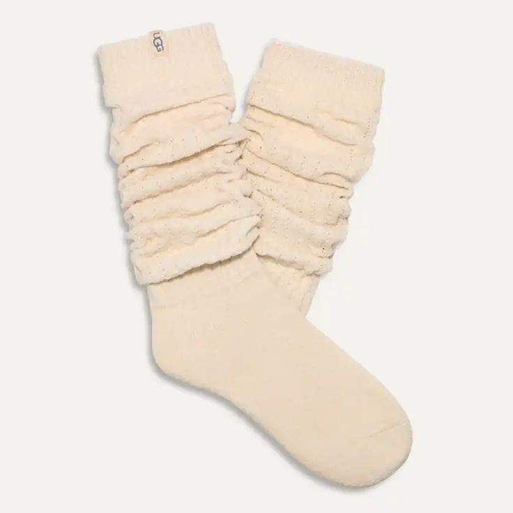 We take lounging VERY seriously, so trust us when we say the Clarice Tall Slouchy Sock is the "it girl" when it comes to comfy socks. Soft, dreamy, and super cozy, you can wear these pulled up to the knee or slouched down. Tall slouchy chenille sock 99% Polyester / 1% Elastane 18" height Soft twill tape with The UGG® Logo on top cuff Fits shoe size: 5-10 Imported Style #1161650 Cozy Comfortable Knee-high Socks For Stocking Stuffers, Cozy Soft Socks One Size, Cozy Soft One-size Socks, Cozy Snug Knee-high Socks, Cozy Mid-calf Socks For Stocking Stuffers, Cozy One Size Socks For Stocking Stuffer, Comfortable Cotton Knee-high Socks, Cozy Super Soft Cream Socks, Cozy Fitted Cream Socks