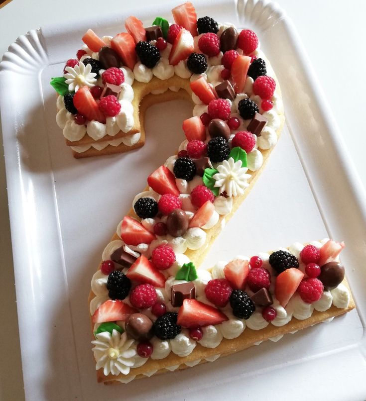 a number 2 made out of fruit on a plate