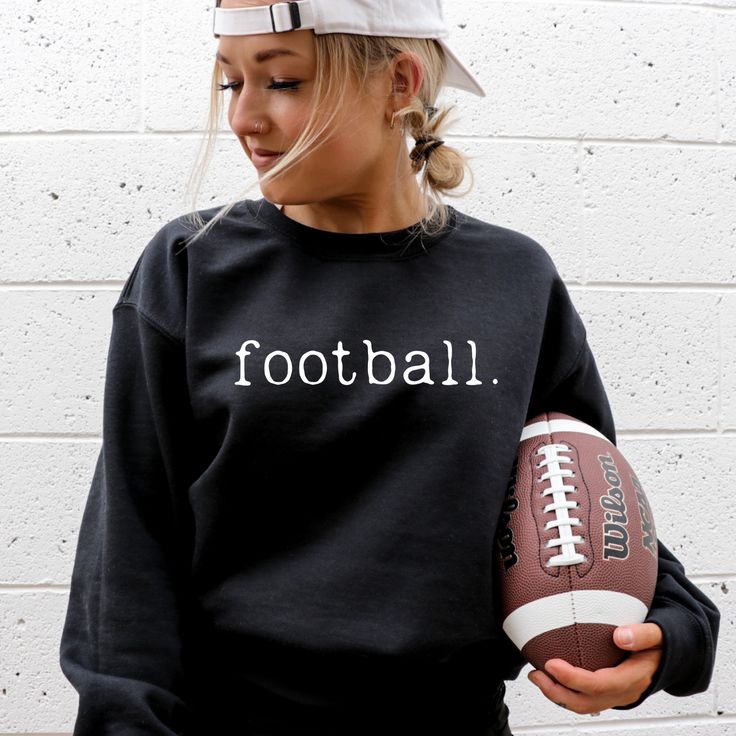 Experience ultimate comfort and style with our Football Sweatshirt. Made with soft and cozy material, this sweatshirt is perfect for any casual occasion. Embrace its simplicity and elevate your wardrobe. Get yours now and feel the passion of the game! Black Sweatshirt For Game Day In Fall, Casual Black Sweatshirt For Football Season, Black Team Spirit Sweatshirt For Fall, Black College Sweatshirt For Football Season, Black Long Sleeve Sweatshirt For Game Day, Black Football Season Sweatshirt, Fall Team Spirit Sweatshirt With Ribbed Cuffs, Trendy Game Day Crew Neck Sweatshirt, Game Day Long Sleeve Sweatshirt For Football Season