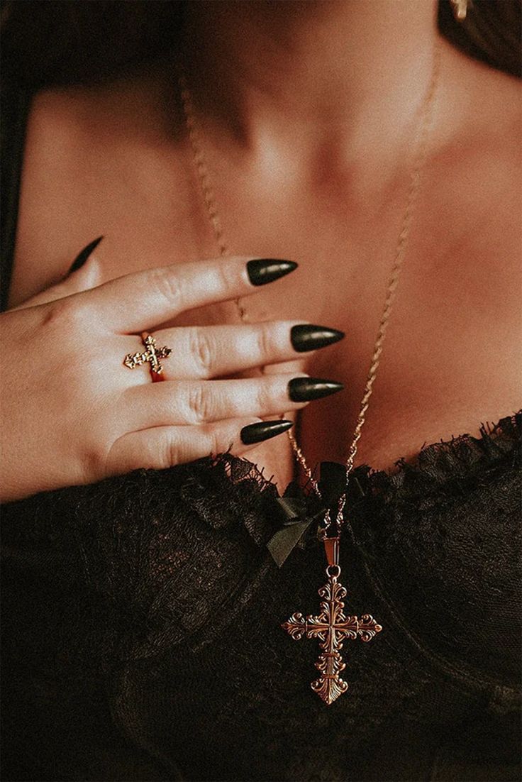 The Lament Gold Cross Necklace is adorned with the solemnity of a cross, a symbol of enduring significance. It is not just a necklace; it's a relic that resonates with the echoes of ancient times, recounting stories of timeless grace. Bathed in rich, opulent gold, this pendant captures the essence of both elegance and darkness. Its golden sheen is a reflection of the allure of the nocturnal, a reminder that beauty thrives even in the heart of the shadows. Size Info: Chain: 72cm Cross: 50mm. Stainless Steel 18k Gold Plaiting. Gold Cross Ring, Cross Necklace Gold, Gold Cross Necklace, Cross Ring, Gold Cross, Gothic Jewelry, Jewellery Accessories, Outfit Aesthetic, The Shadows