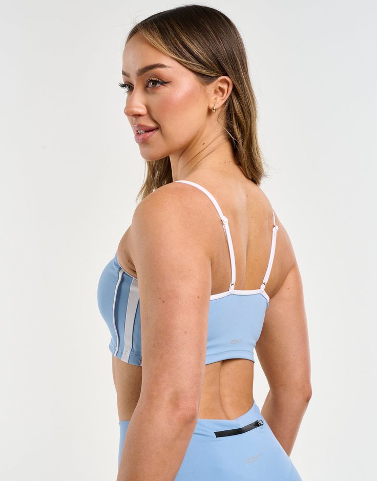 The Freedom Sportsbra combines everything you need in the support of a sports bra into a crop top design. The Freedom Sportsbra is incredibly soft, breathable and perfected in both fit and design - Double lined with no padding - Support is light to moderate - Supportive straps with a crossback design - Fabric is incredibly soft and breathable 80% Polyester, 20% Spandex Bella is wearing a Small, is 5'4" Y2k Inspired Outfit, Crop Top Design, Stylish Bra, Crop Top Designs, Joggers Track Pants, Y2k Retro, Contrast Piping, Flare Leggings, Design Fabric