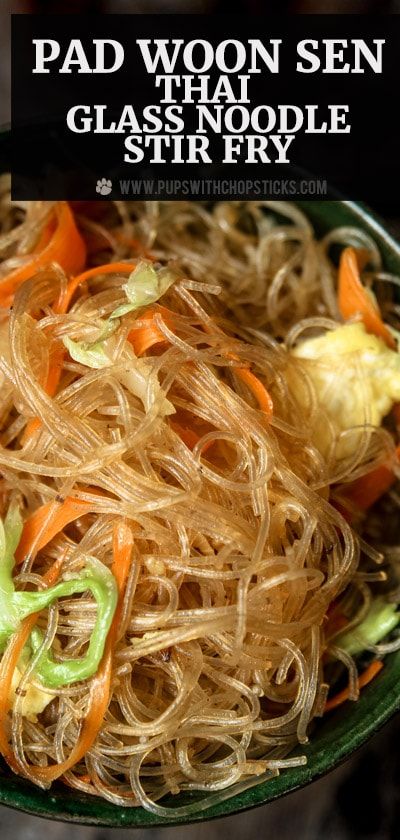 a bowl filled with noodles and vegetables on top of a table