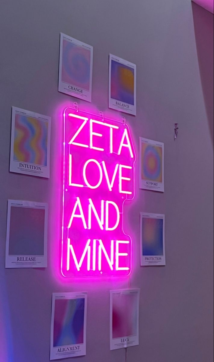 a neon sign that says zeta love and mine on it's wall next to some pictures