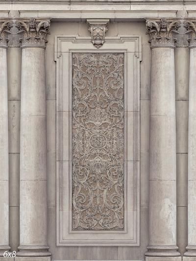 an old building with columns and a decorative panel on the front wall that looks like it has been carved from stone