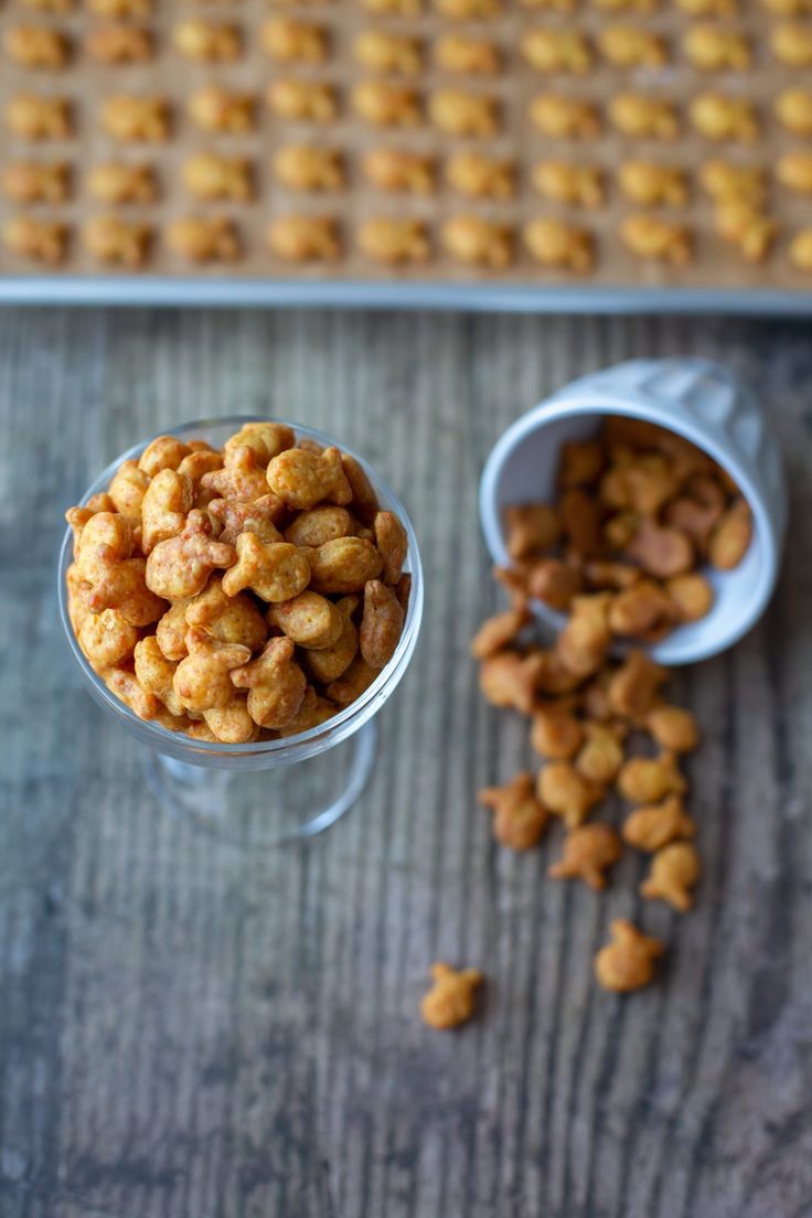 two cups filled with cereal sitting on top of a table