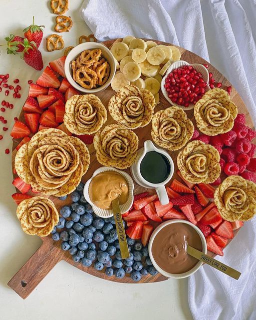 a platter filled with fruit and snacks