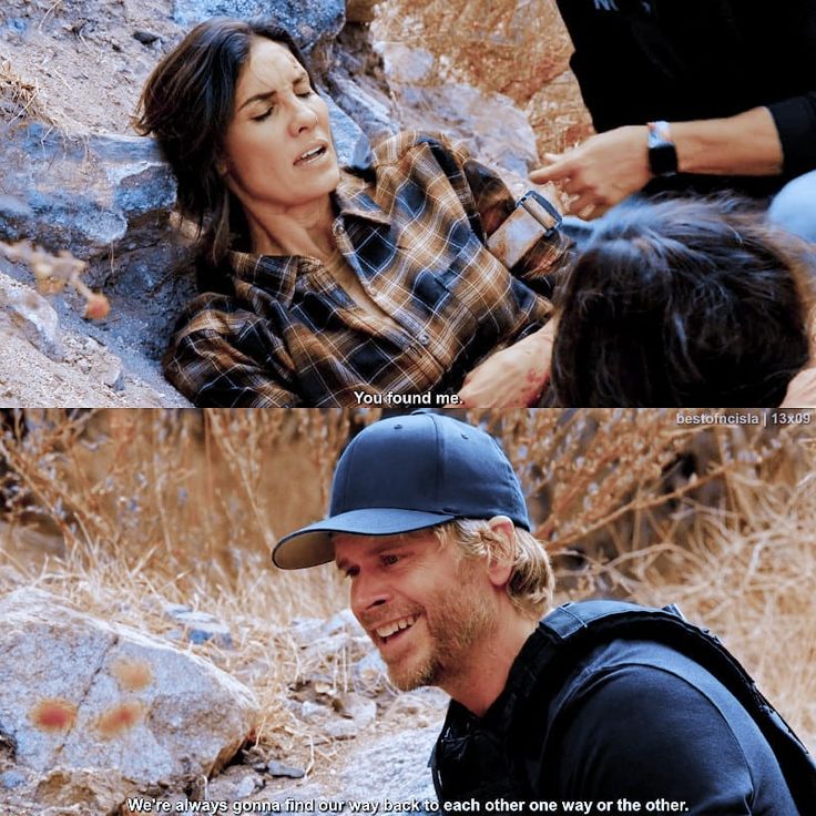 a man sitting on top of a rock next to a woman in a hat and plaid shirt