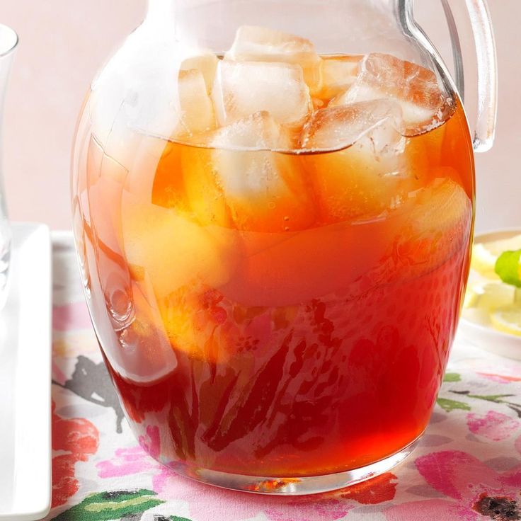 a pitcher filled with ice sitting on top of a table