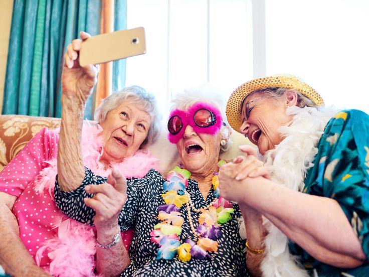 three older women are posing for a photo