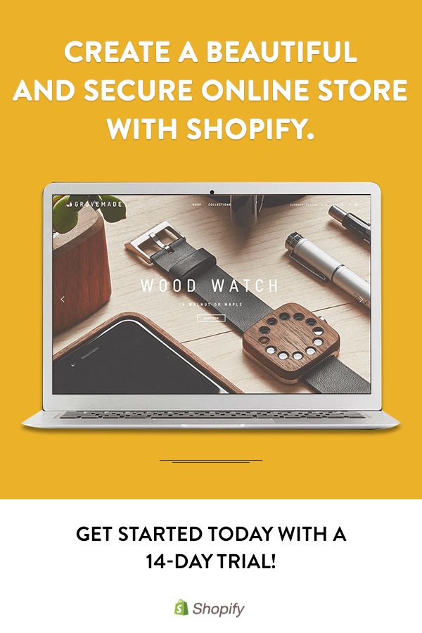 an open laptop computer sitting on top of a desk next to a cup and plant