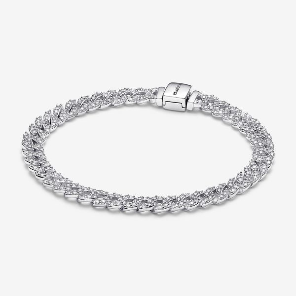 Elevate your look with the Pandora Timeless Pavé Cuban Chain Bracelet. This sterling silver bracelet features sparkling links in a chain. The top of each half circle is set with three round stones, while the back of the chain is polished for shine and comfort. The bracelet closes with a flat, square-shaped clasp featuring an engraved Pandora logo. Combining the linear geometry of our iconic chains with sparkling pavé, this sterling silver chain bracelet is a forever piece with of-the-moment appe White Gold Cuban Link Bracelet With Solid Construction, Classic White Gold Cuban Link Sterling Silver Bracelet, Classic Link Chain Tennis Bracelet, Silver Tennis Bracelet With Round Chain, Classic Diamond Bracelet With Chain, Silver Cubic Zirconia Chain Tennis Bracelet, Silver Link Bracelet With Cubic Zirconia, White Gold Cubic Zirconia Link Chain Bracelet, White Gold Diamond Jubilee Bracelet