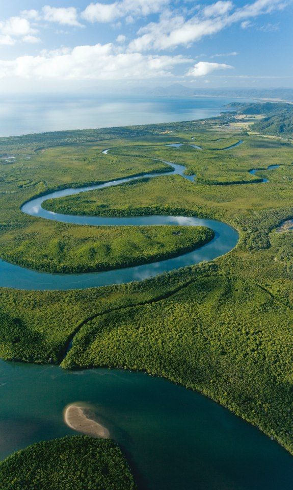 an aerial view of the river and land