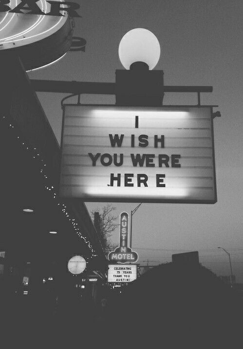 a neon sign that says i wish you were here