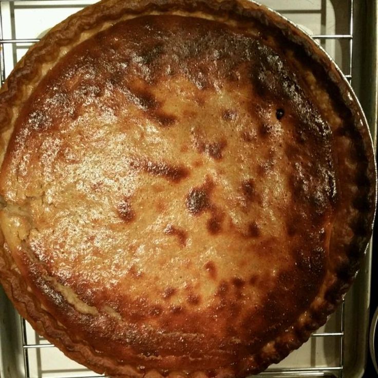 a pie sitting on top of a metal rack