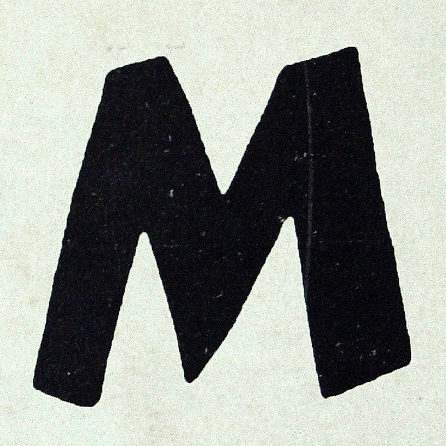 the letter m is made up of black letters