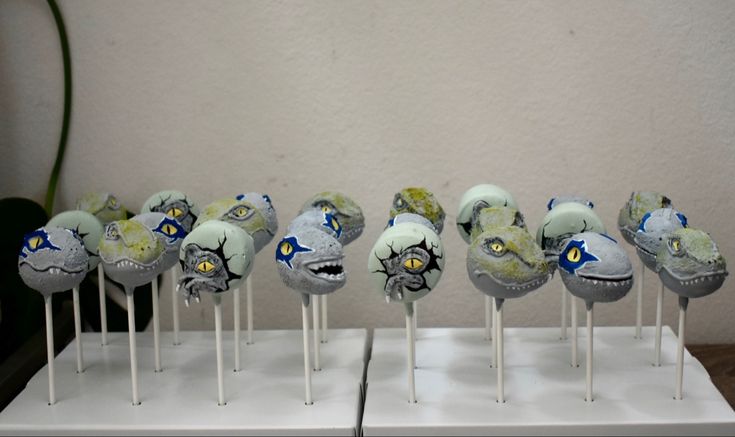 several lollipops with different designs on them are lined up in a row