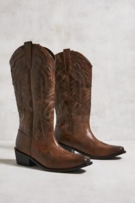 Step out in fierce cowboy boots from UO. These leather-crafted boots feature an unmistakable Western style with stitched detailing throughout, curved hems, pull tabs, a pointed toe and a block heel. **Content + Care** \- Leather, Rubber \- Wipe clean **Size** \- Heel height: 6cm | UO Brown Leather Dallas Cowboy Boots - Brown UK 4 at Urban Outfitters Dallas Cowboys Boots, Brown Cowboy Boots Outfit, Look Western, Dressy Sneakers, Soft Leather Boots, Everyday Fits, Brown Cowboy Boots, Dallas Cowboy, Cowboy Rodeo