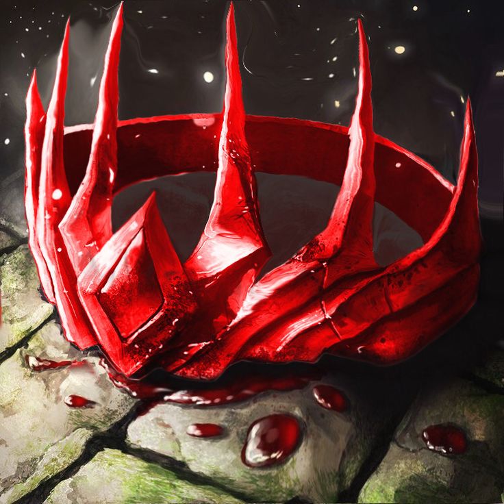 a red crown sitting on top of a rock covered in blood