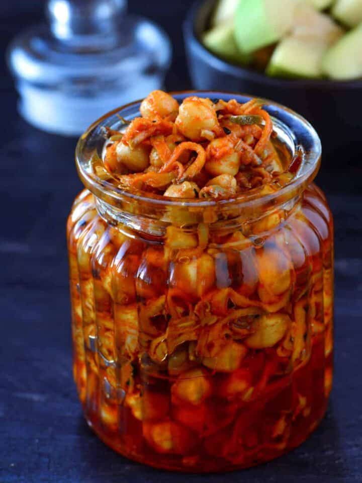 a glass jar filled with food sitting on top of a table