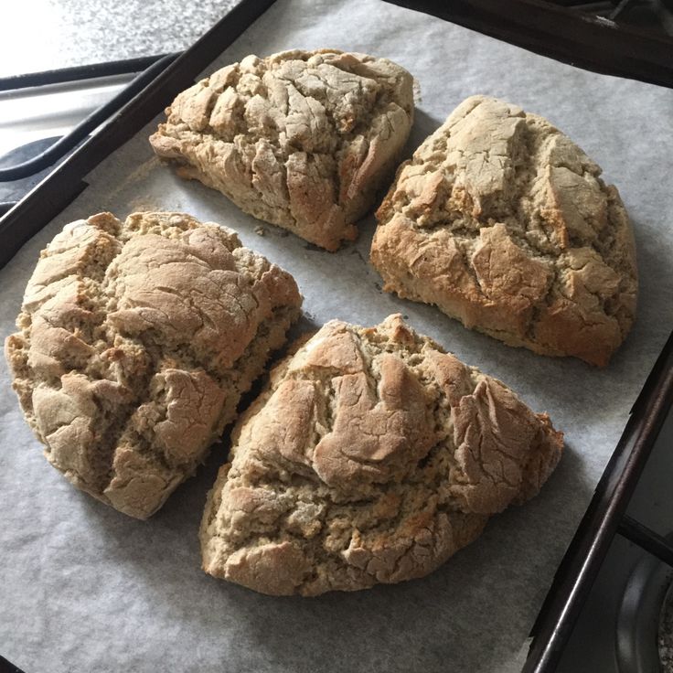 four pieces of bread sitting on top of a baking sheet