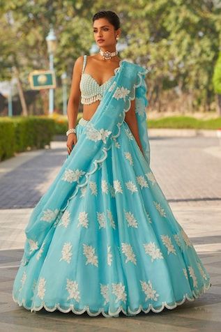 Blue attached cancan scallop hem lehenga hand embroidered with floral applique work. Paired with a tassel detailed, pearl embellished padded blouse. Comes with an embroidered scallop hem dupatta. - Aza Fashions Flower Lehenga, Lehenga Blue, Pearl Blouse, Vani Vats, Lehenga Pattern, Reception Dresses, Blue Lehenga, Bridal Elegance, Indian Wedding Wear