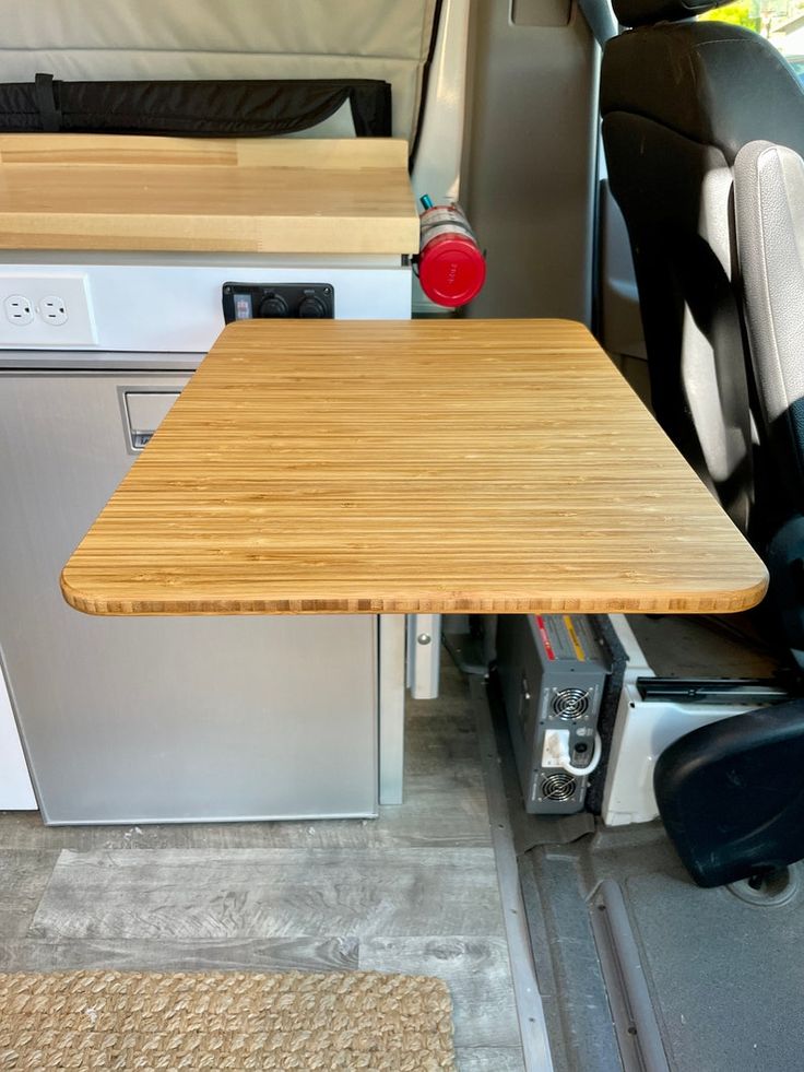 a table in the back of a van with no one around it or someone else