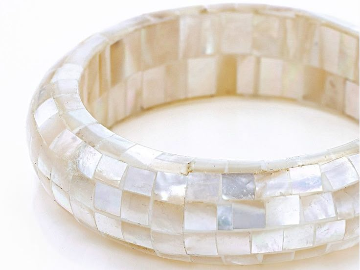 Pacific Style™  White Free-form Mosaic Mother-of-Pearl Bangle Bracelet. Measures Approximately 8"L x 0.45"W. No Closure. Color and Pattern May Vary. Internal Bangle Circumference is 8". Solid bangle, Not Adjustable. White Beaded Bracelets With Oyster Style For Formal Occasions, White Beaded Oyster Bracelets For Formal Occasions, White Beaded Oyster Bracelet For Formal Occasions, Mother Of Pearl Bracelet, White Pearl Bangle, White Mother Of Pearl Bracelet For Wedding, White Mother Of Pearl Bracelets For Wedding, White Pearl Bracelet With Mother Of Pearl, White Pearl Round Bangle