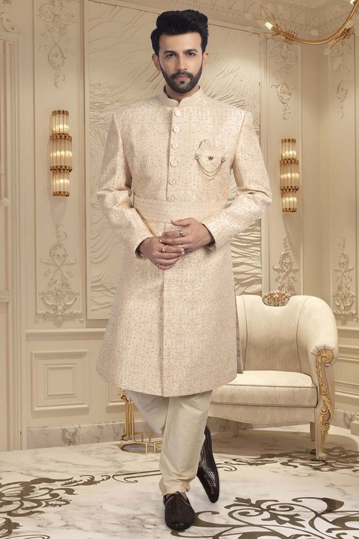 Make your big day even more special with our Mens Sherwani S20-S368! This groom's sherwani is adorned with stunning stones, adding a touch of luxury to your wedding ensemble. It will make you shine on your big day. Elegant Groom's Nehru Jacket With Dabka Work, Eid Wedding Sherwani With Dabka, Eid Wedding Sherwani With Dabka Embroidery, Wedding Long Bandhgala With Dabka Details, Long Bandhgala With Dabka For Wedding, Elegant Traditional Wear With Dabka Work For Groom, Cream Sherwani For Groom Eid Celebration, Cream Sherwani For Groom Eid Festival, Cream Sherwani For Groom At Eid