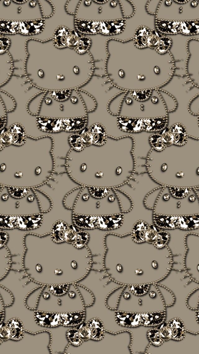 an abstract pattern with silver and black dots on grey fabric, which is very similar to the cat's head