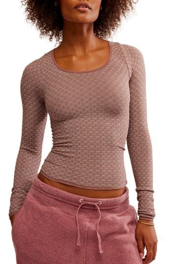 A knit-to-fit top is textured in a tonal print and bares a bit of belly to add some sass. 21" length (size Medium) Scoop neck Long sleeves 64% nylon, 28% polyester, 8% spandex Machine wash, dry flat Imported Fitted Textured Knit Top For Loungewear, Textured Long Sleeve Tops For Fall, Spring Textured Tops For Loungewear, Spring Textured Loungewear Tops, Textured Tops For Spring Loungewear, Stretch Pointelle Knit Top With Scoop Neck, Textured Crew Neck Tops For Fall, Soft Texture Stretch Crew Neck Tops, Fitted Jacquard Knit Tops For Spring