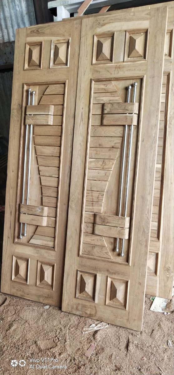 two wooden doors sitting next to each other