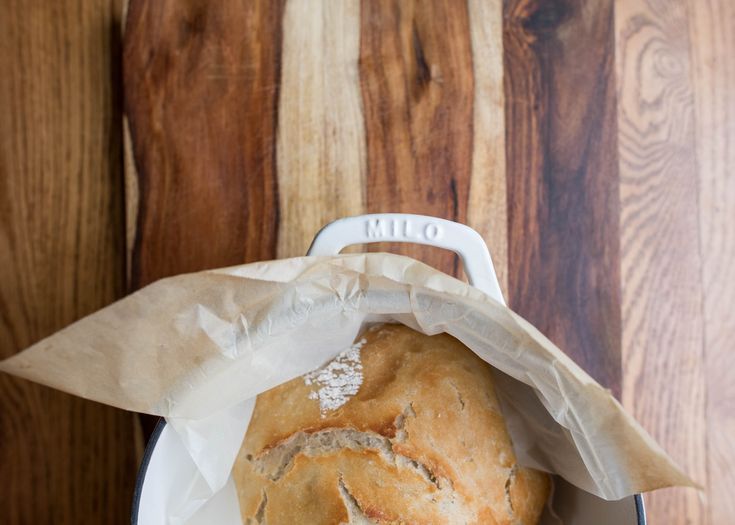 a loaf of bread sitting in a bag on top of a table