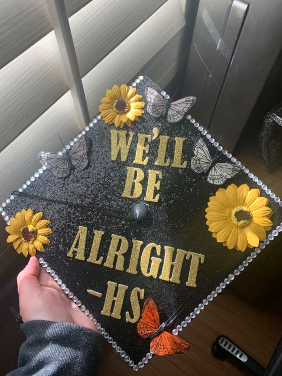 a graduation cap that says well be alright - hs with sunflowers and butterflies on it