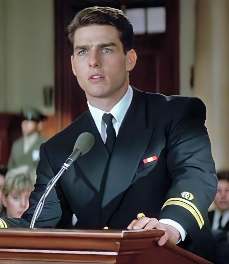 a man in uniform standing at a podium