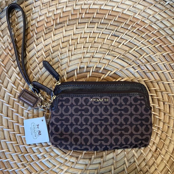 Nwt Coach Wristlet Brown Leather With Two Zippered Pockets Brown Pouch Wristlet For On-the-go, Brown Pouch Wristlet For Travel, Chic Brown Wristlet For Everyday Use, Coach Brown Clutch With Removable Pouch, Brown Coach Clutch With Removable Pouch, Coach Brown Wallet For On-the-go, Coach Brown Wallets For On-the-go, Coach Brown Clutch For Travel, Brown Wristlet With Zipper Pouch For Daily Use