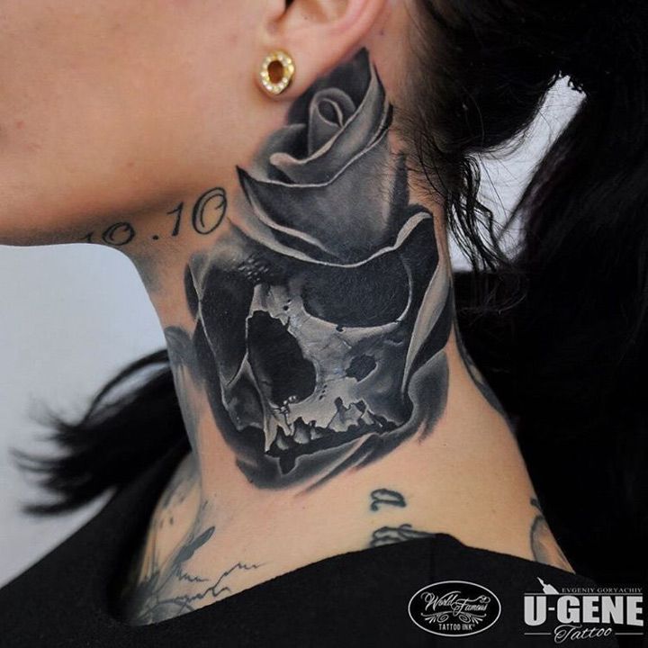 a woman with a skull and rose tattoo on her neck