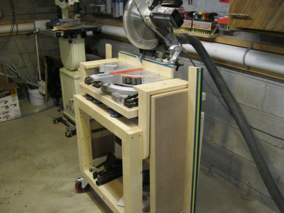 a machine that is sitting on top of a wooden shelf in a room filled with tools