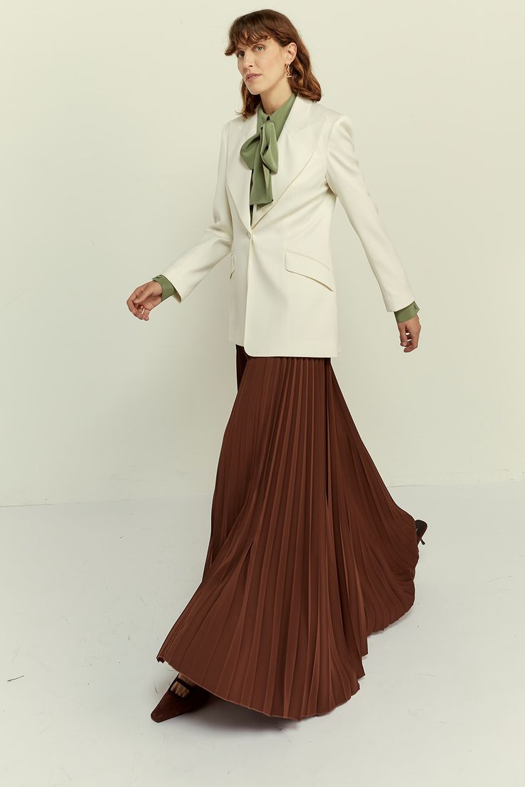 The pleated design adds a touch of texture and movement, creating a flattering A-line silhouette that complements all body types. Whether it features delicate knife pleats for a refined look or bold accordion pleats for added volume, our Pleated Skirt showcases meticulous craftsmanship and attention to detail. 100% Recycled Polyester Fully Pleated Dry Clean Only. This product cannot be washed at home. Please store the product on a clips hanger. Elegant Pleated Skirt For Evening, Classic A-line Maxi Skirt For Formal Occasions, Classic A-line Pleated Skirt For Fall, Fall A-line Pleated Maxi Skirt, Elegant Folded Maxi Skirt For Evening, Elegant Evening Maxi Skirt With Folds, Elegant A-line Maxi Skirt With Pleated Hem, Flowy Workwear Skirt With Folds, Elegant Pleated Skirt For Formal Occasion