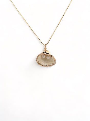 Seashells By The Seashore Necklace – Carolina Benoit Gold Ocean-inspired Shell With Pearl Pendant, Ocean-inspired Gold Shell With Pearl Pendant, Gold Shell Necklace With Pearl Pendant, Gold Shell-shaped Necklace With Pearl Pendant, Gold Shell Jewelry With Pearl Pendant, Gold Shell With Pearl Pendant, Gold Pearl Pendant Charm Necklace For Beach, Gold Charm Necklace With Pearl Pendant For Beach, Ocean-inspired Gold Shell Charm Necklace