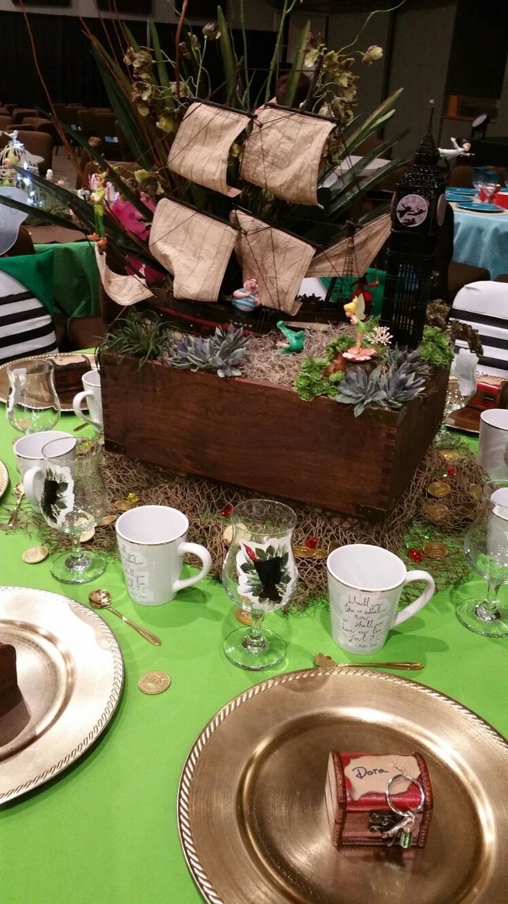 the table is set with dishes, cups, and napkins for a holiday celebration