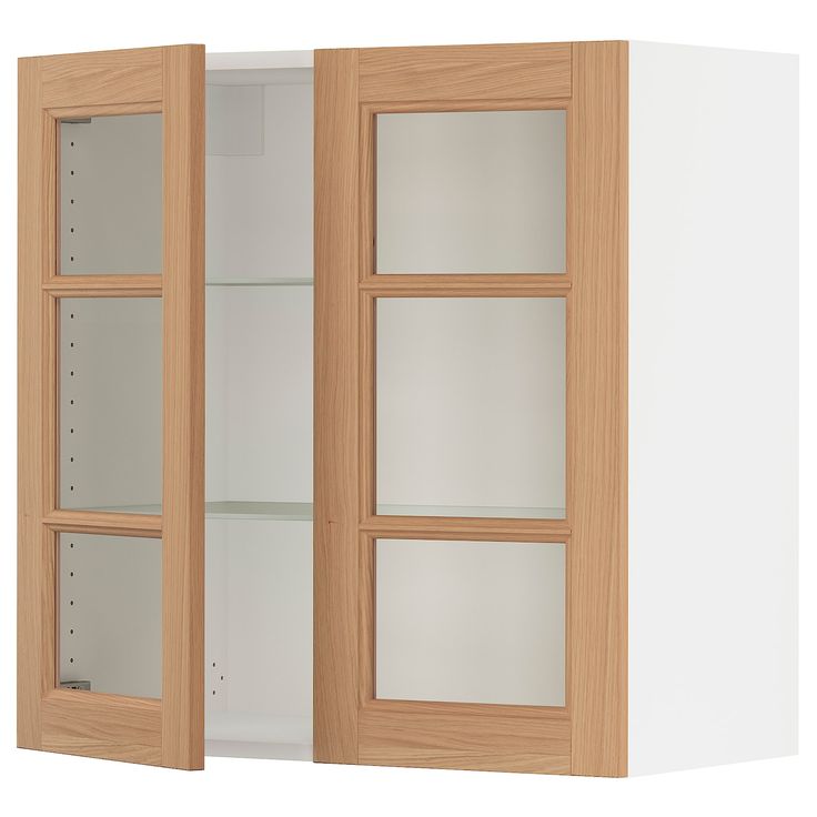 an open wooden cabinet with glass doors on the front and back sides, against a white wall