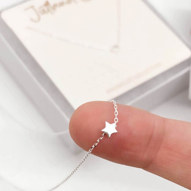 Your Tiny Silver Star Necklace Ships Today From Fort Collins, Colorado! This Dainty And Delicate Necklace Is Made With 100% Sterling Silver And Specifications: Dainty S925 Sterling Silver Star Necklace With Cable Chain. Bright Silver 2mm Cable Chain Necklace Length Is 14 Inches With An Additional 2 Inch Extender This Star Is Teeny Tiny! Jewelry Care Tips: Avoid Direct Contact With Perfumes, Body Lotions And Other Chemicals Remove Jewelry When Bathing, Showering Or Sleeping Store Jewelry In A Coo Silver Necklace Dainty, Star Print Jewelry As A Gift, Party Star Charm Necklaces, Silver Star-shaped Dainty Jewelry, Cheap Dainty Star Necklace, Dainty Sterling Silver Star Necklace, Jewelry Care Tips, Cheap Dainty Star-shaped Necklace, Star-shaped Tiny Necklace For Gift