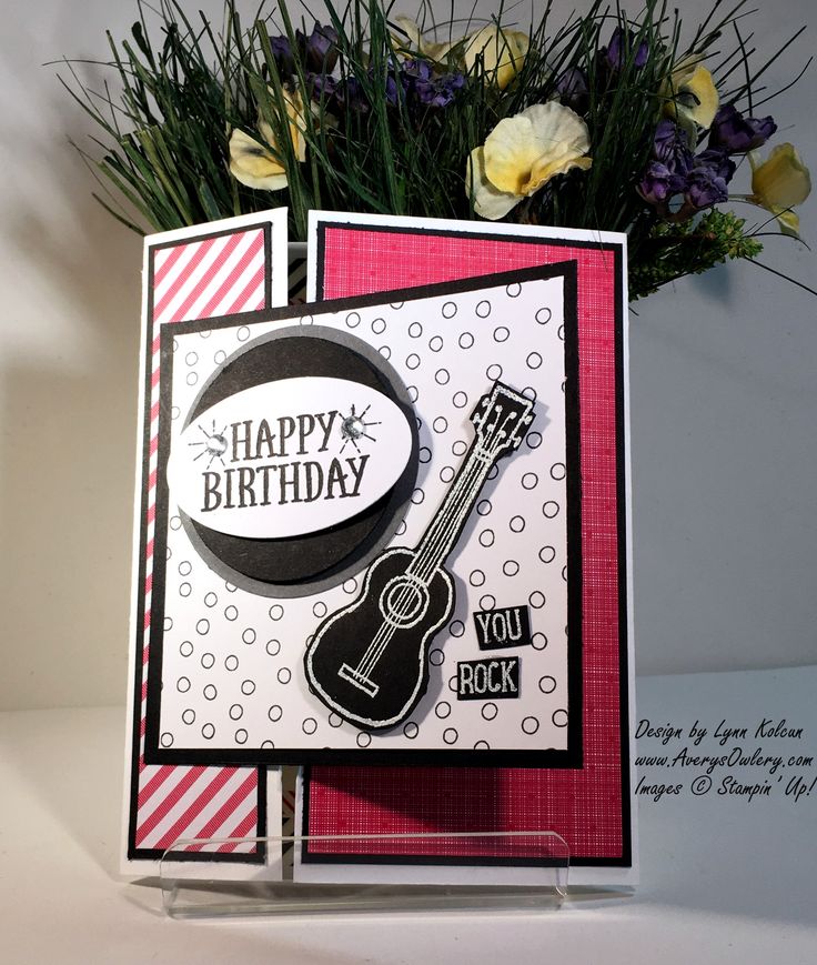 a birthday card with a guitar and flowers