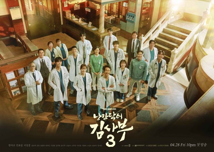 a group of people in lab coats posing for a photo