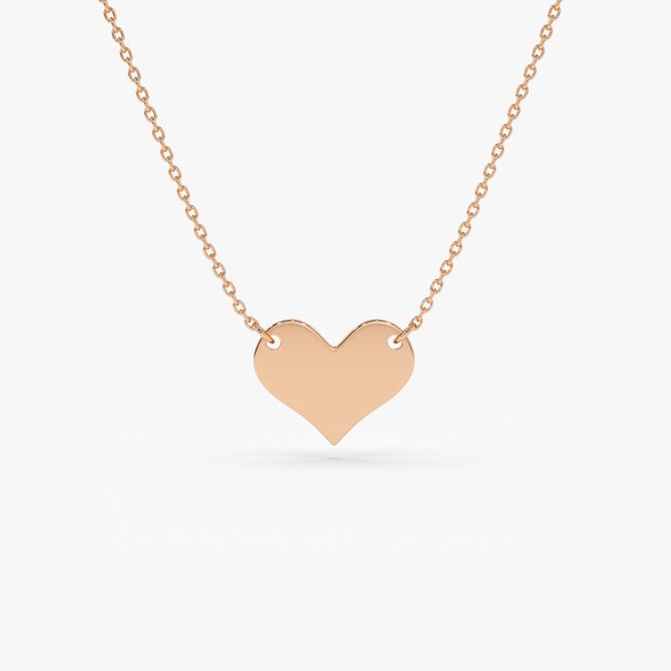 Gold KT: 14K
Pendant - 8.5mm x 10mm

A tiny 14K gold heart hangs daintily from a thin gold chain. Create a truly perfect self-love talisman. Choose from: Rose Gold, Yellow Gold, and White Rhodium. In the hustle and bustle of everyday, sometimes we can just forget to be nice to ourselves. Treat yourself to this pretty little gold heart pendant necklace and celebrate your best relationship. Heart Pendant Gold, Gold Heart Necklace, The Hustle, Best Relationship, Gold Heart, Necklace Sizes, Heart Pendant Necklace, Heart Of Gold, Gold Yellow