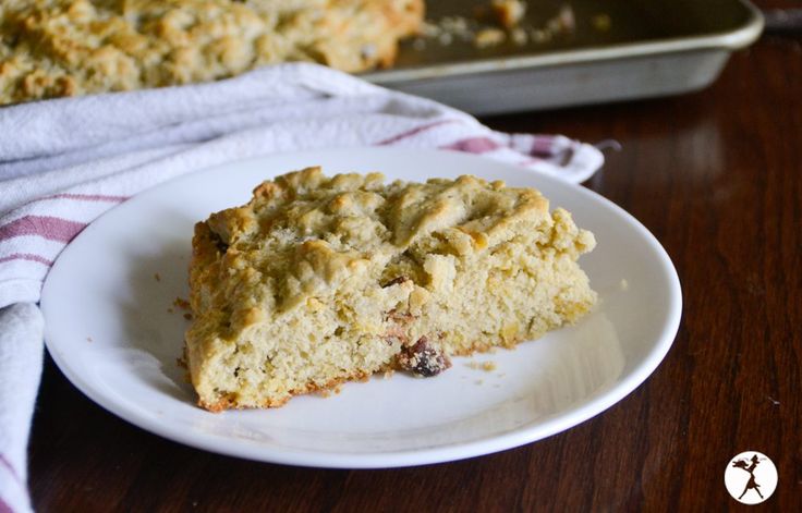 a piece of cake sitting on top of a white plate next to a baking pan